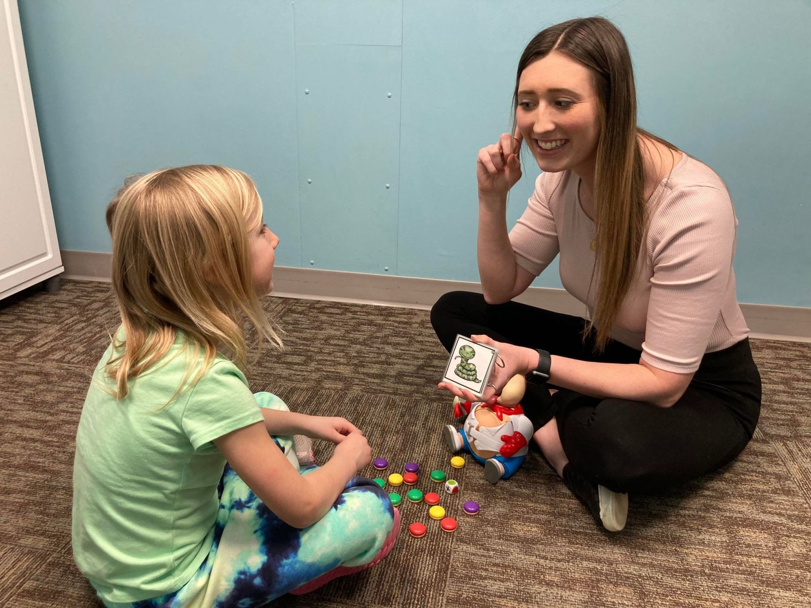 Image of Taylor Physical Therapy's therapist with a peds patient Physical Therapist Kristen Kahler