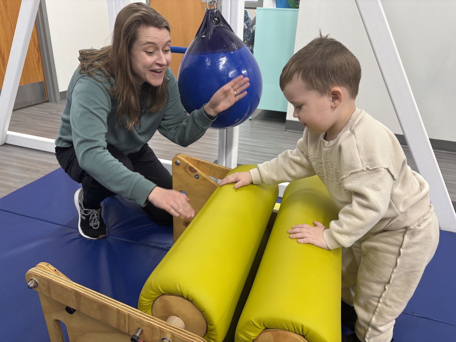 Image of Taylor Physical Therapy's therapist with a peds patient Physical Therapist Kristen Kahler