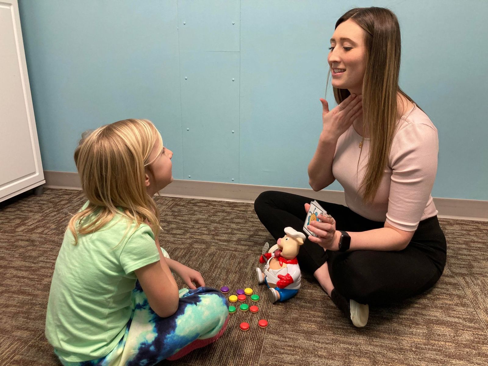Image of Taylor Physical Therapy's therapist with a peds patient Physical Therapist Kristen Kahler